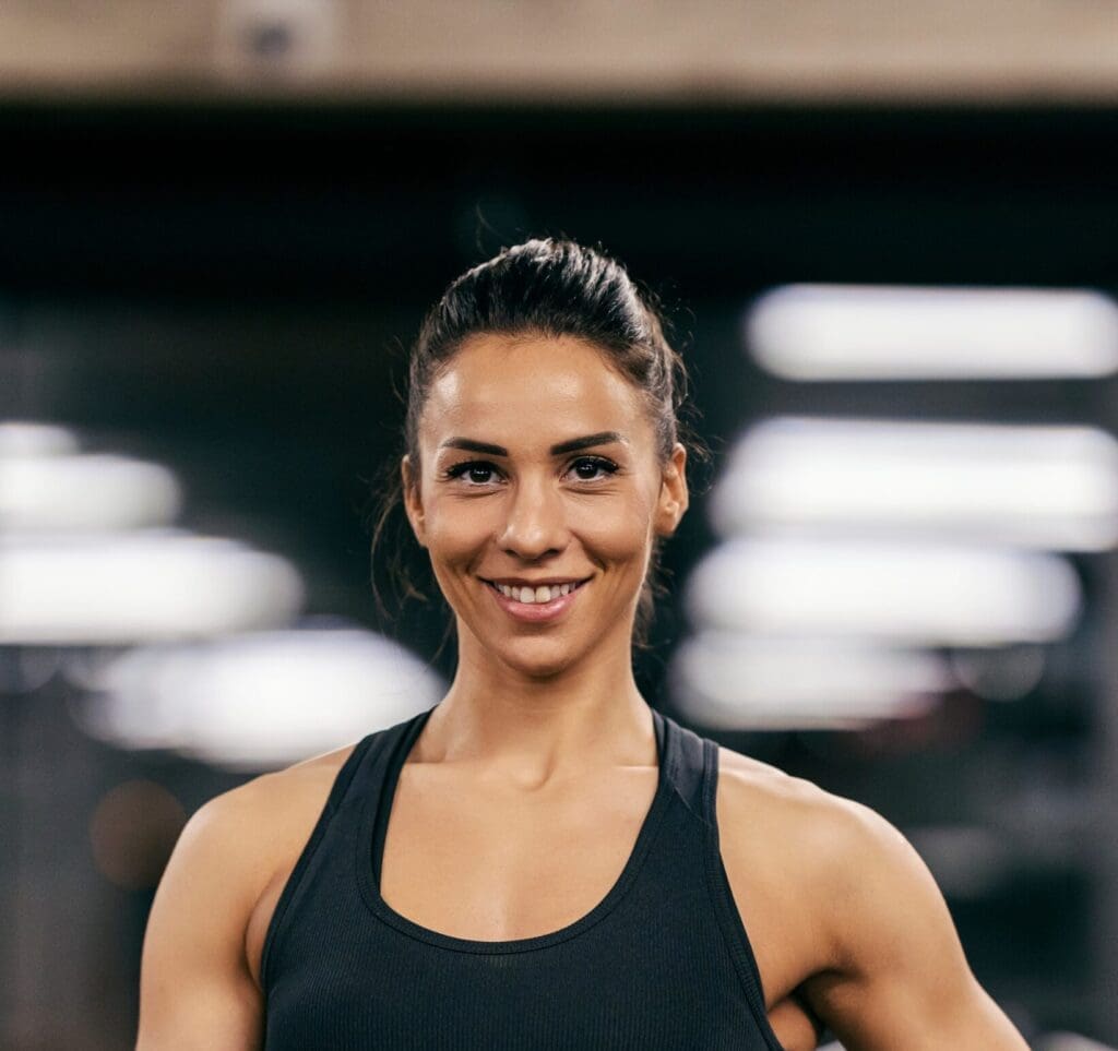 Personal trainer at Third Level Fitness guiding a strength training session in Clayton, NC